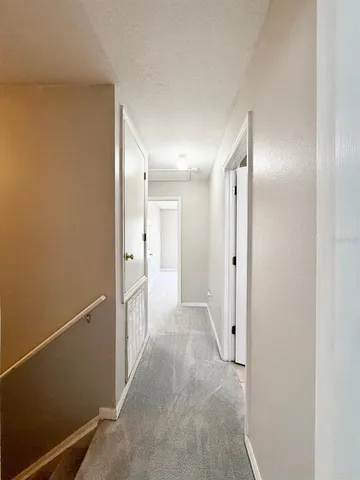 a bedroom with a bed and a potted plant