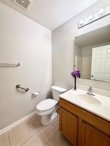 a bathroom with a bath tub with a shower