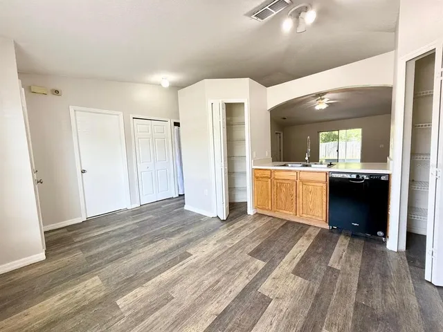 a spacious bathroom with a sink and a mirror