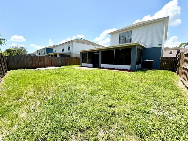 a front view of a house with a yard table and chairs