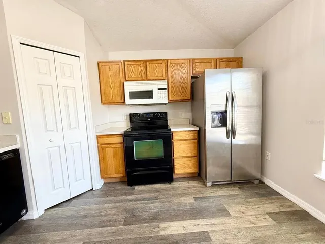 a kitchen with a sink and a appliances