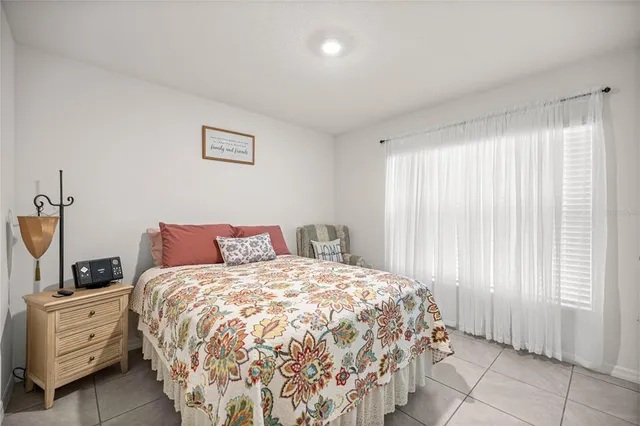 a bed room with a bed and a window