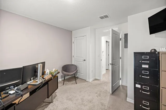 a view of a workspace with furniture