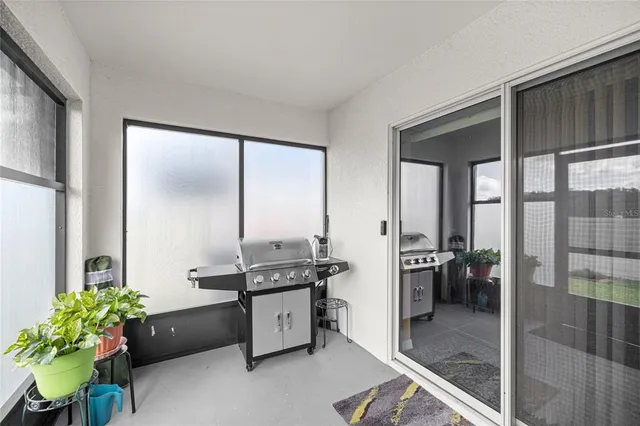 a kitchen with stainless steel appliances kitchen island granite countertop a stove a sink and a refrigerator