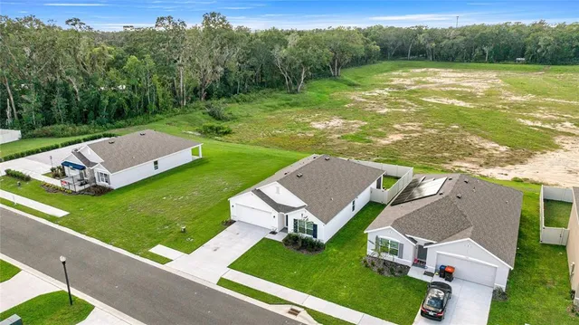 an aerial view of a house with pool