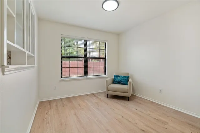 a living room with furniture and window