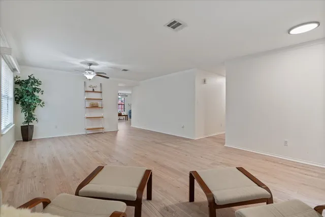 a living room with furniture and flowers