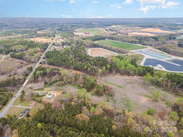 an aerial view of a houses with a yard