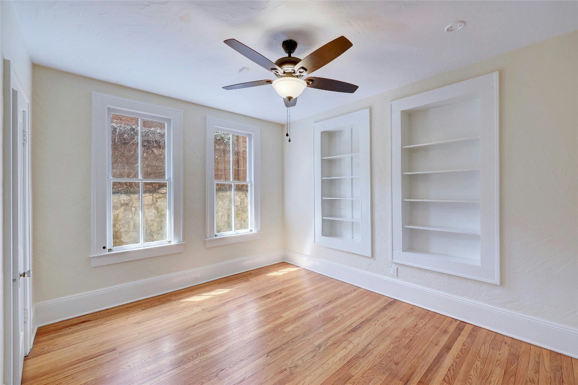 1920 Newning Avenue Austin, TX 78704 - Photo 13 of 26 a view of an empty room with a window and wooden floor