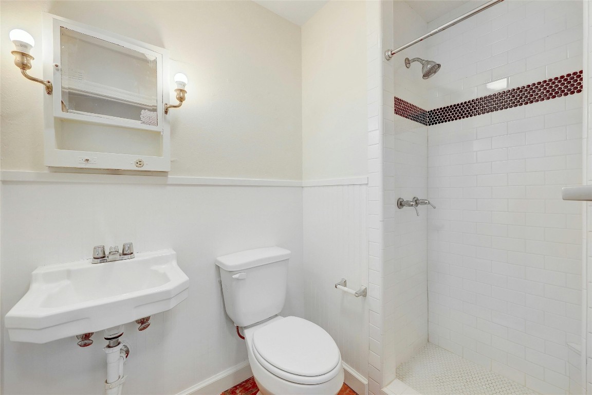 1920 Newning Avenue Austin, TX 78704 - Photo 16 of 26 a white toilet sitting next to a bathroom sink