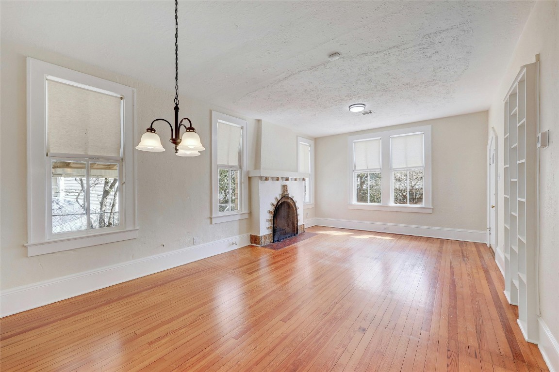 1920 Newning Avenue Austin, TX 78704 - Photo 7 of 26 a view of empty room with wooden floor and fan