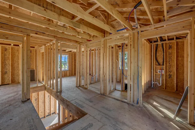 a view of a bathroom with a tub and shower