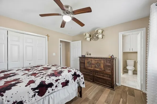a bathroom with a toilet sink and shower