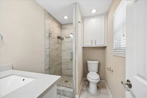 a bathroom with a sink vanity and a mirror