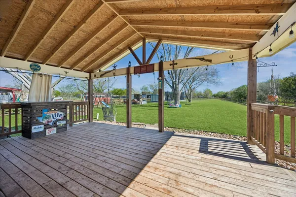 a view of a backyard with sitting area