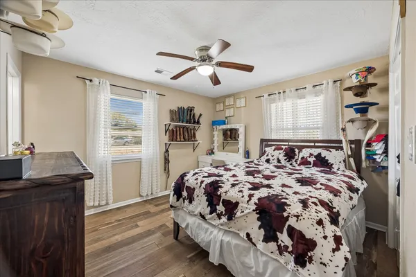 a bedroom with a bed and a dresser