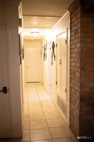 a view of a porch with furniture and a yard