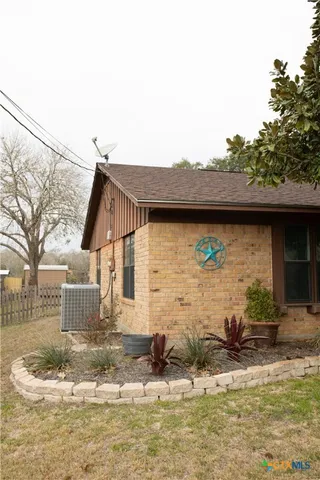 a view of a house with snow on the wall