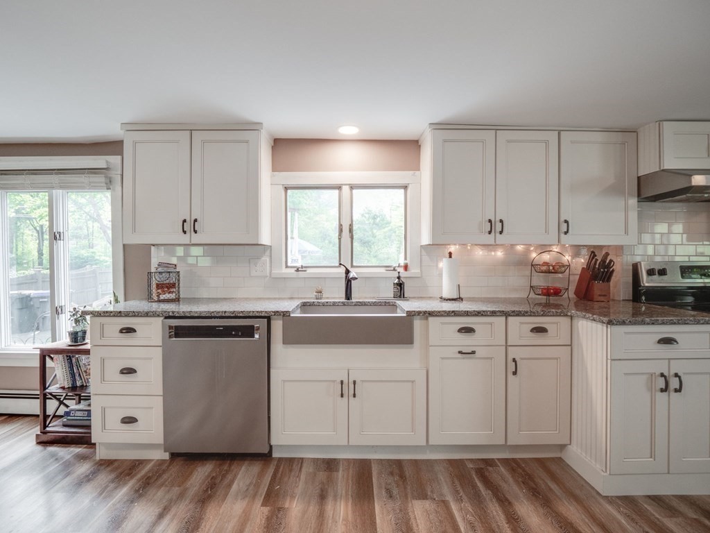 59 Hubbardston Road Templeton, MA 01468 - Photo 5 of 28 a kitchen with granite countertop a sink cabinets stainless steel appliances and a window