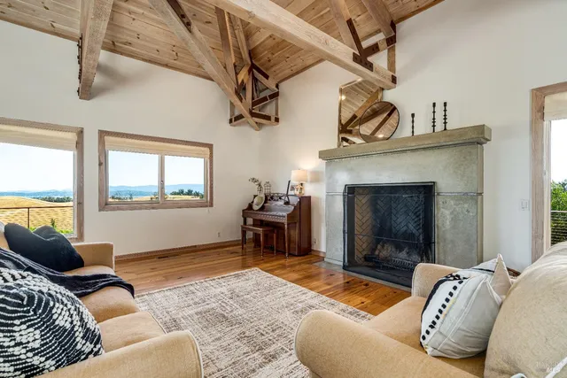 a view of a patio with dining table and chairs