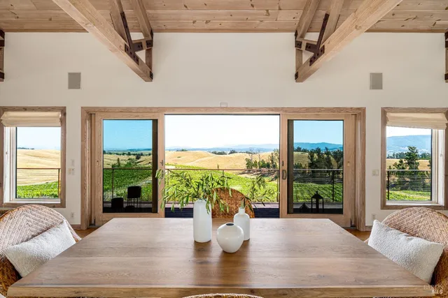 a view of a dining hall with many windows