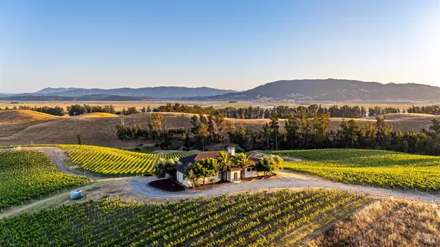 a view of a swimming pool with a table and chairs