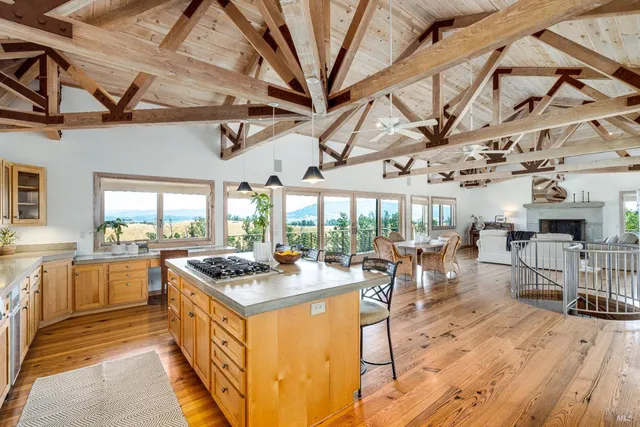 a bed room with a bed and a large window