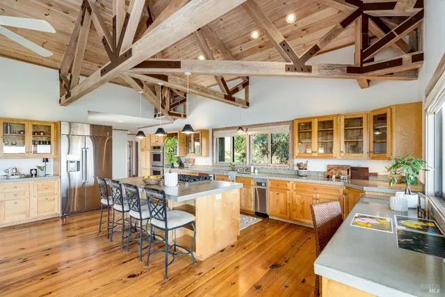 a bedroom with a large bed and a large window