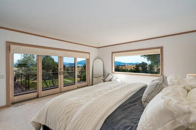 a spacious bathroom with a granite countertop sink mirror and toilet
