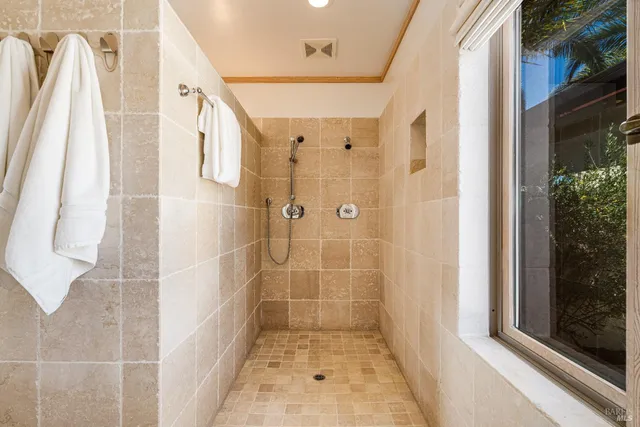 a outdoor sitting area with furniture and wooden floor