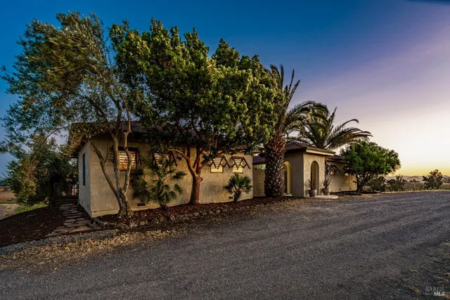 a view of a swimming pool with a yard