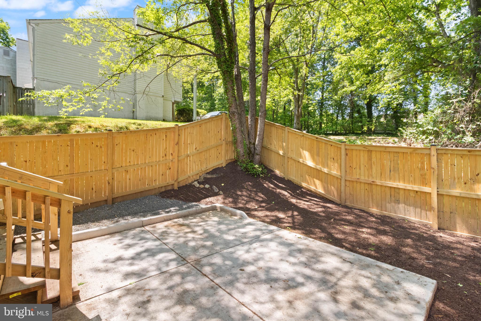 8581 Chester Grove Court Springfield, VA 22153 - Photo 18 of 38 a view of a backyard with wooden fence
