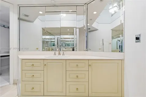 a bathroom with a double vanity sink a mirror a shower and vanity