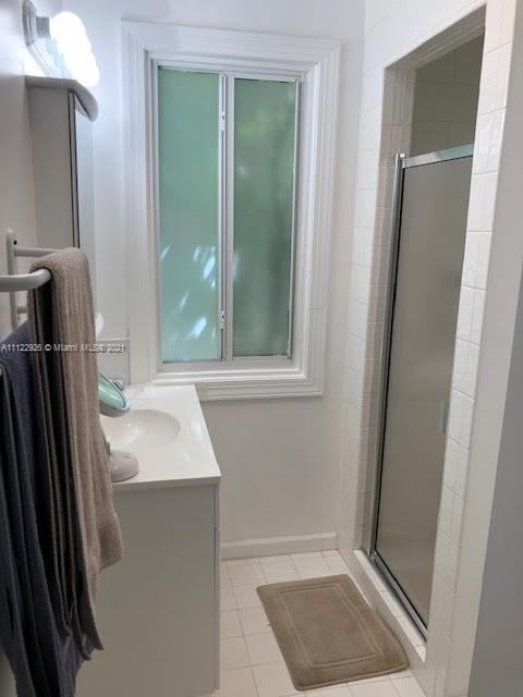 3797 El Prado Boulevard Miami, FL 33133 - Photo 18 of 26 a bathroom with a sink a toilet and vanity