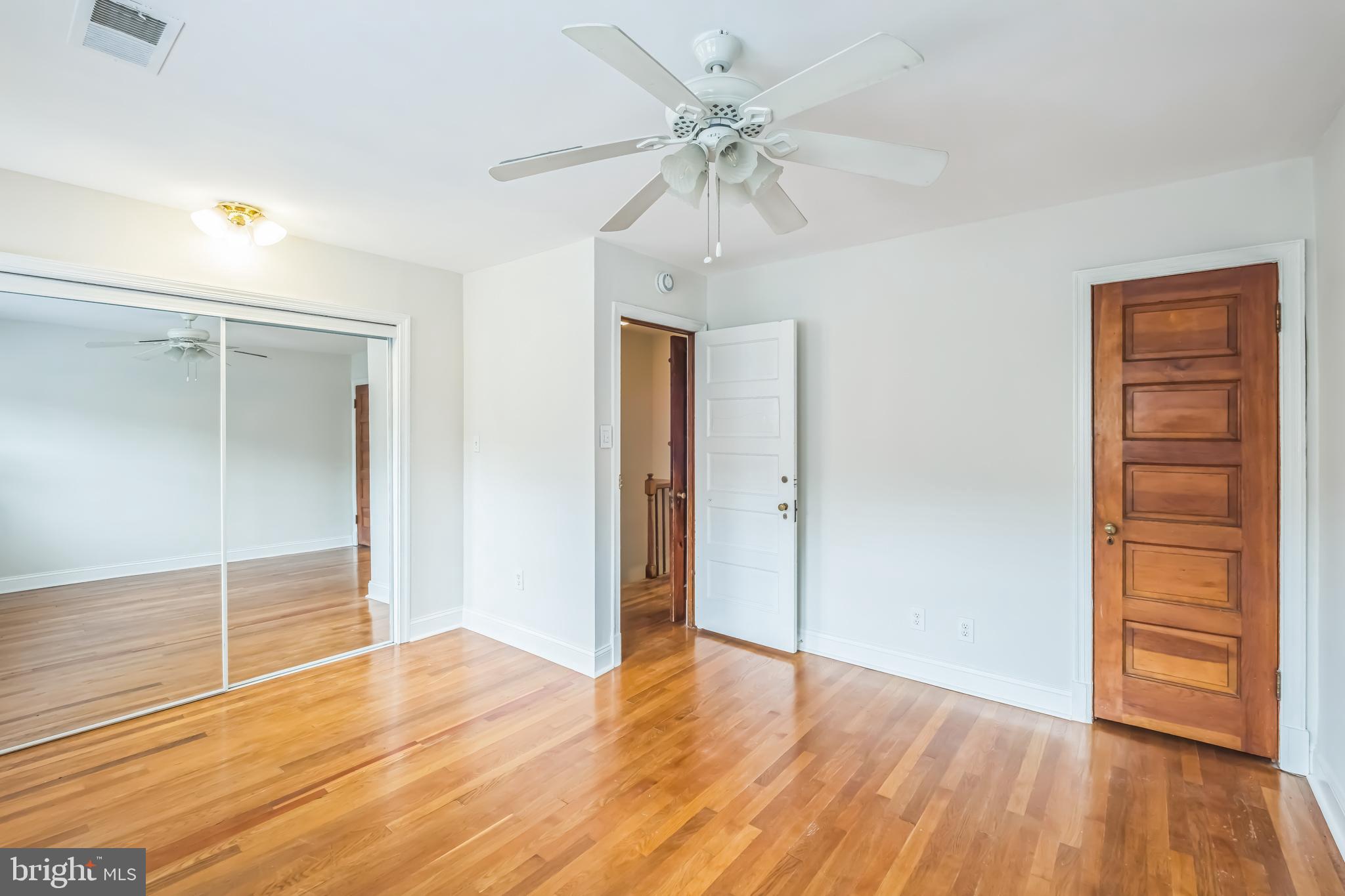 1407 K Street Southeast Washington, DC 20003 - Photo 14 of 30 a view of an empty room with wooden floor