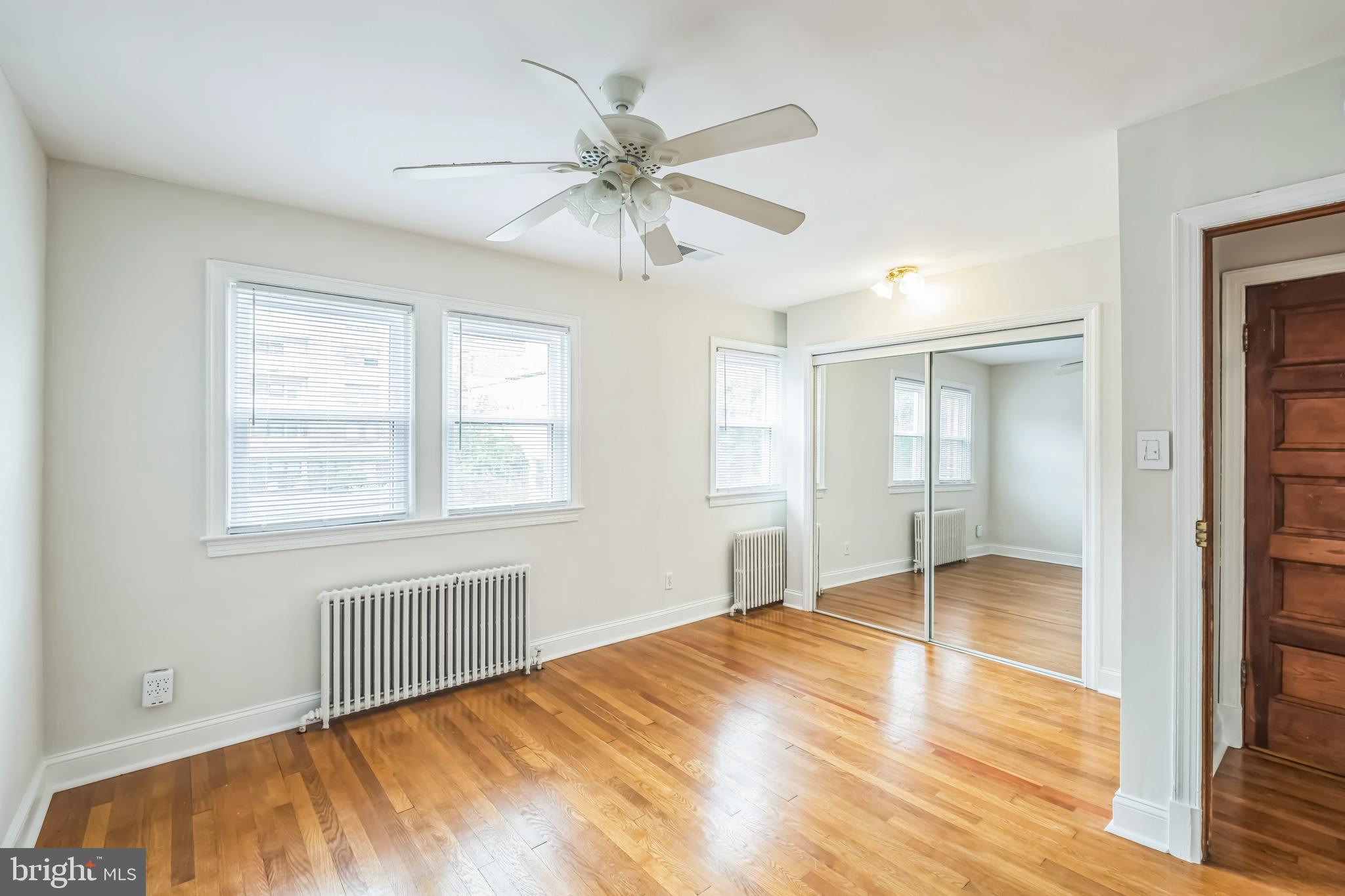 1407 K Street Southeast Washington, DC 20003 - Photo 16 of 30 a view of an empty room with wooden floor and a window