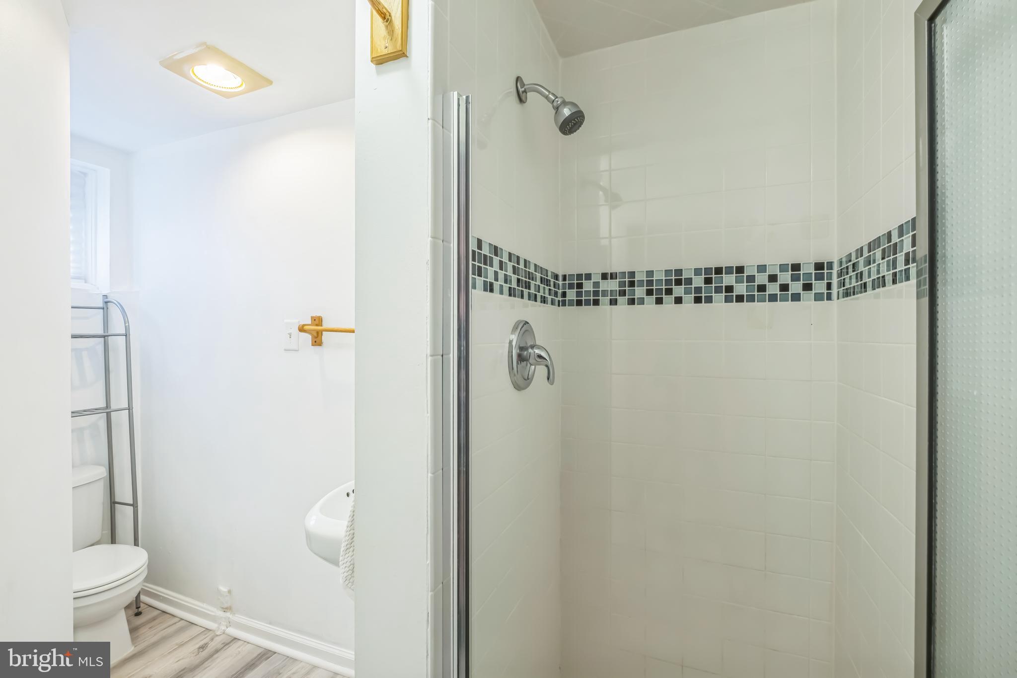 1407 K Street Southeast Washington, DC 20003 - Photo 19 of 30 a bathroom with a toilet and a shower