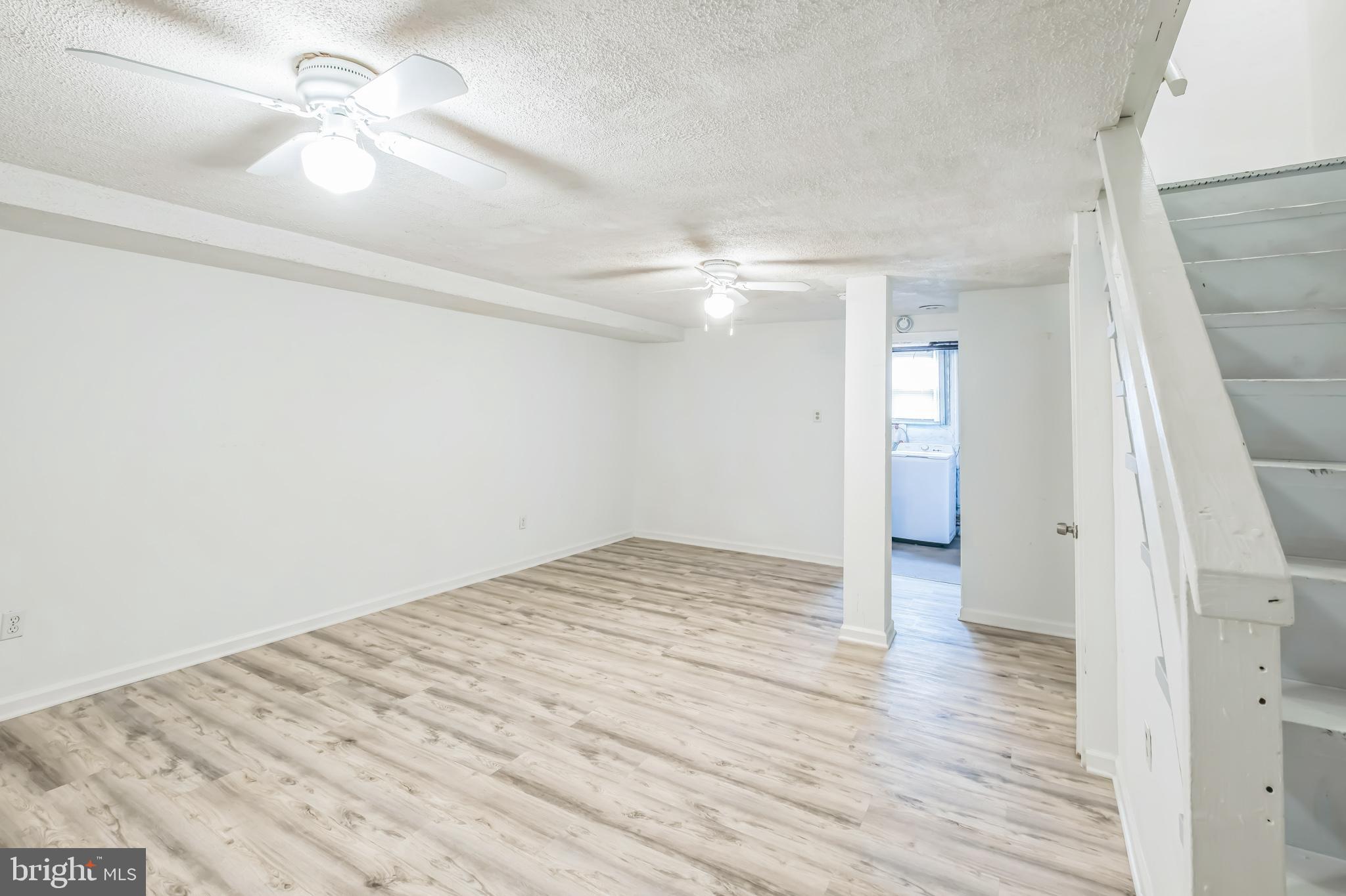1407 K Street Southeast Washington, DC 20003 - Photo 20 of 30 wooden floor in an empty room with a window