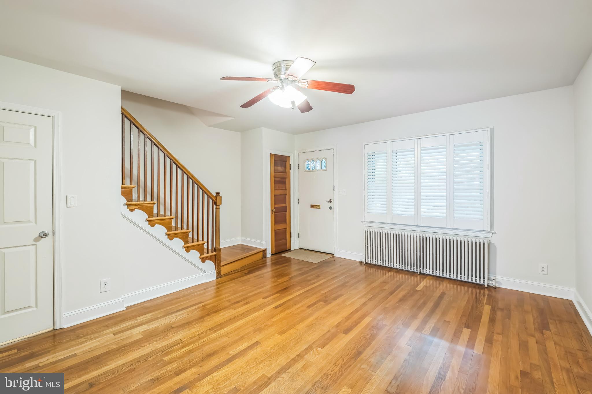 1407 K Street Southeast Washington, DC 20003 - Photo 2 of 30 a view of an empty room with wooden floor and a window