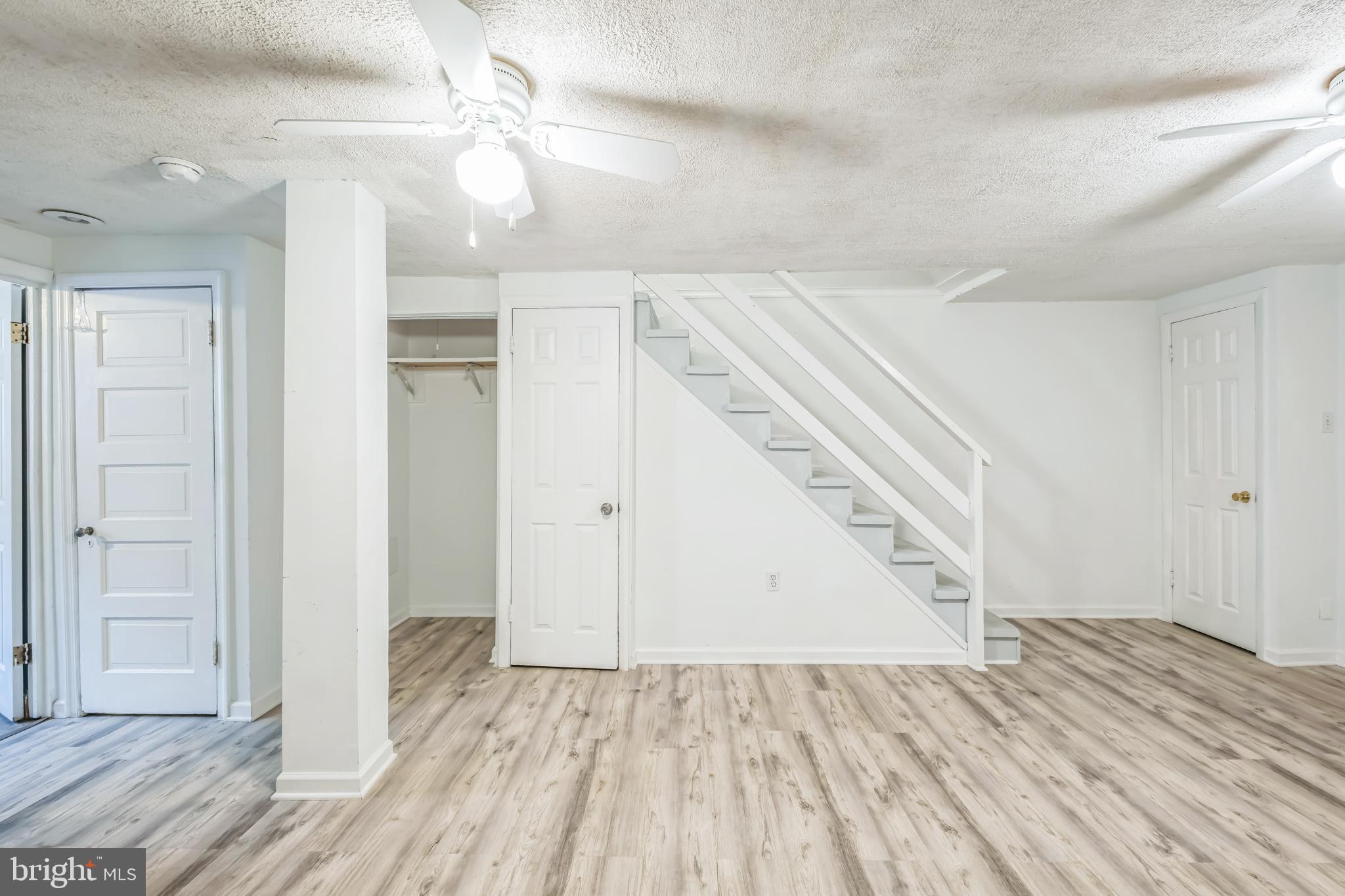 1407 K Street Southeast Washington, DC 20003 - Photo 21 of 30 wooden floor in an empty room with a bathroom