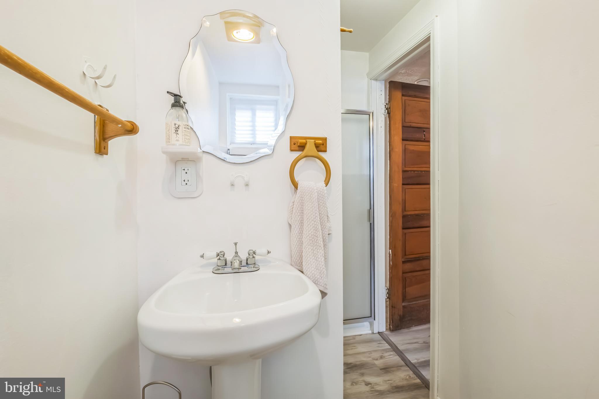 1407 K Street Southeast Washington, DC 20003 - Photo 22 of 30 a bathroom with a sink and a mirror