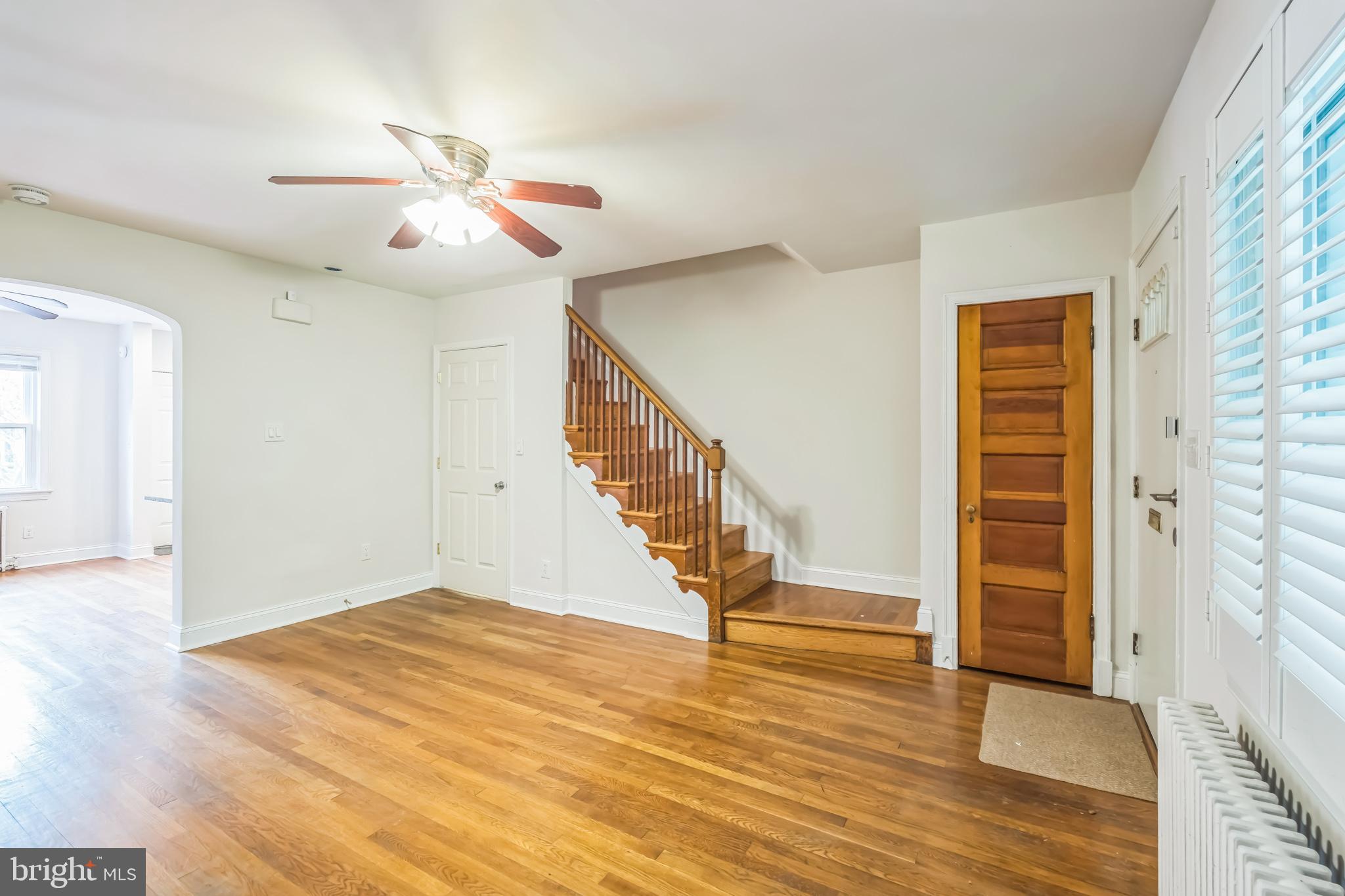 1407 K Street Southeast Washington, DC 20003 - Photo 4 of 30 a view of empty room with wooden floor and fan
