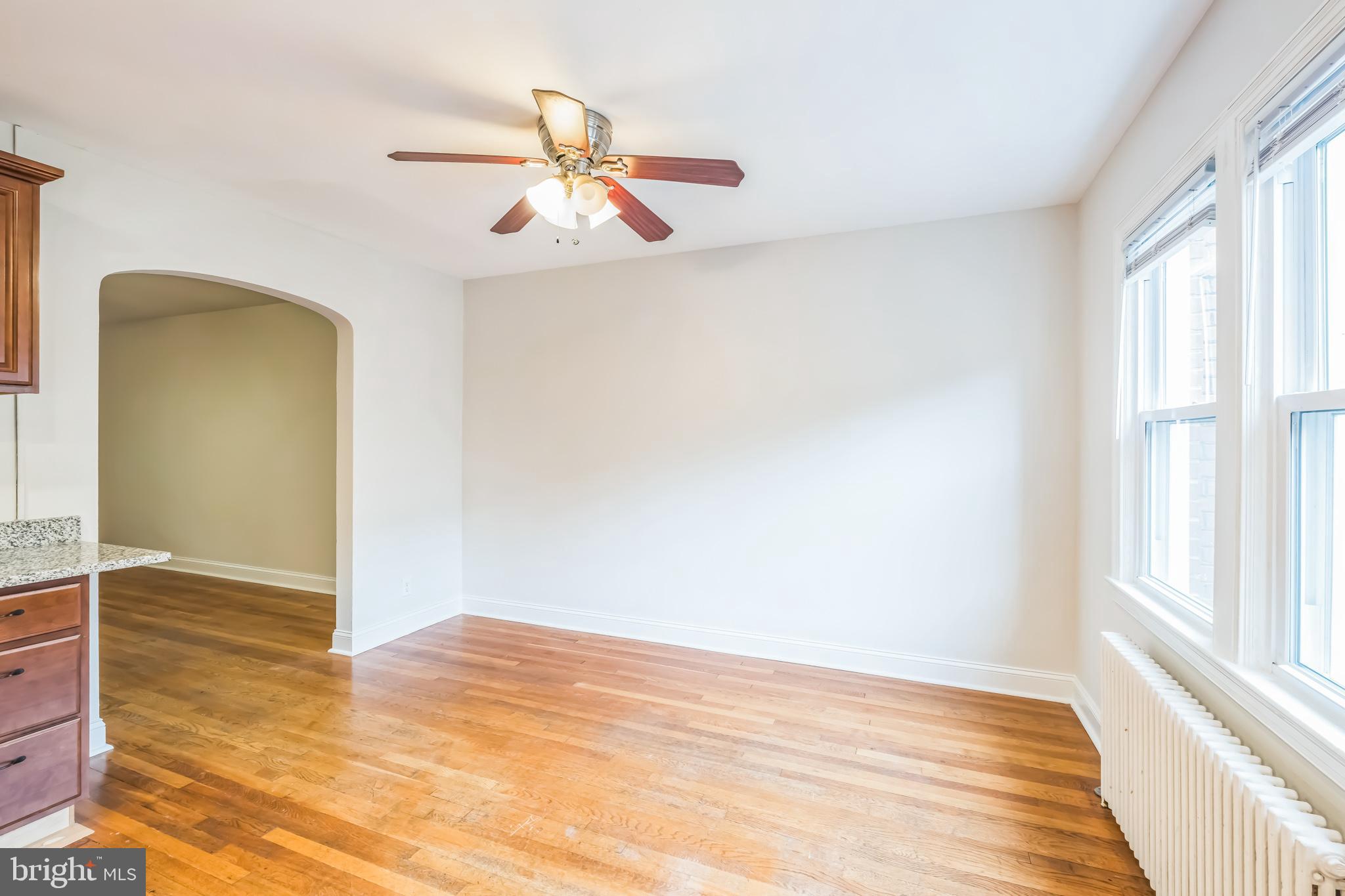 1407 K Street Southeast Washington, DC 20003 - Photo 6 of 30 a view of empty room with wooden floor and fan