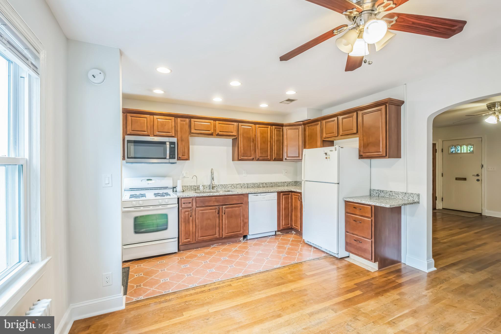 1407 K Street Southeast Washington, DC 20003 - Photo 7 of 30 a large kitchen with stainless steel appliances granite countertop a stove and a sink