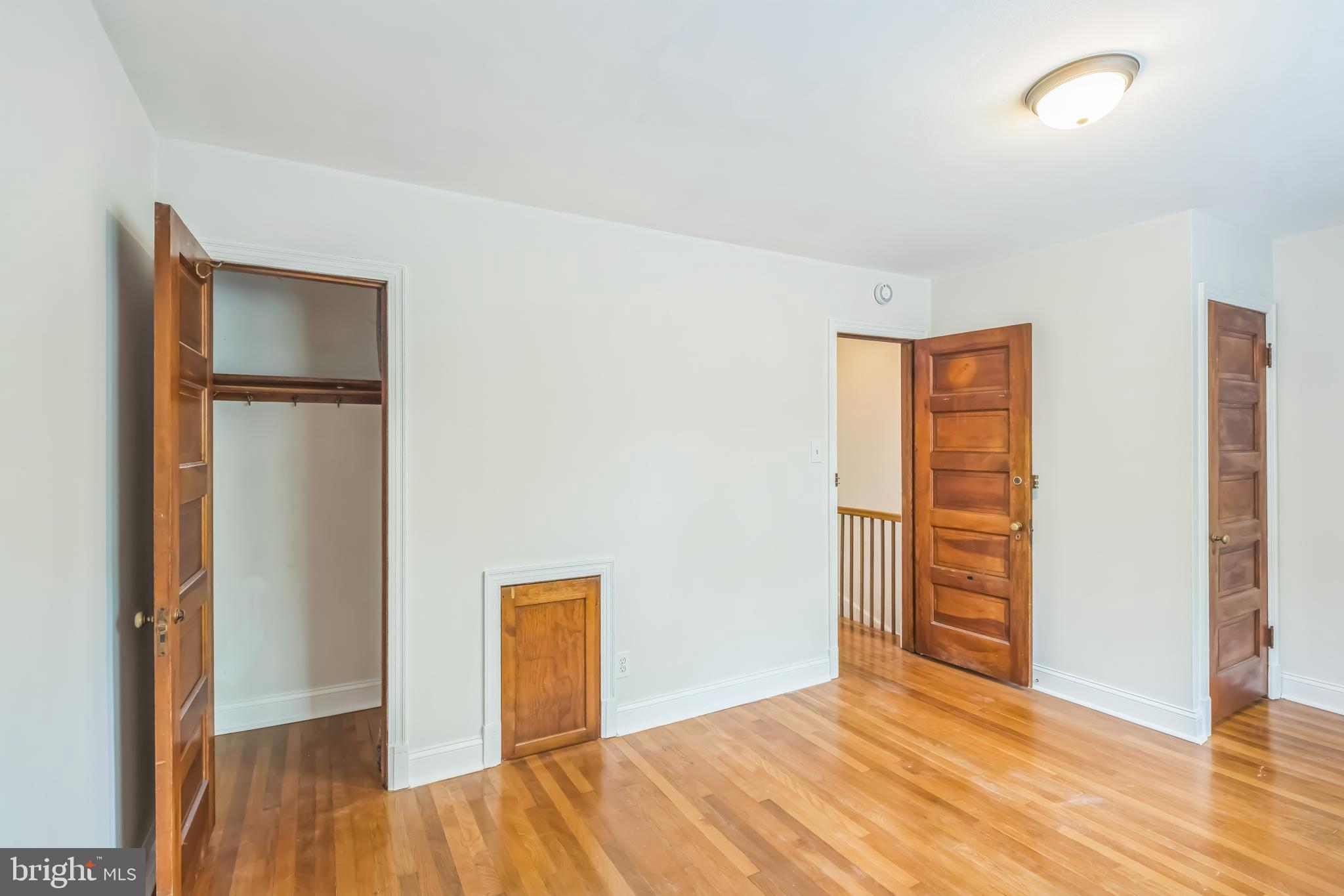 1407 K Street Southeast Washington, DC 20003 - Photo 10 of 30 an empty room with wooden floor and closet
