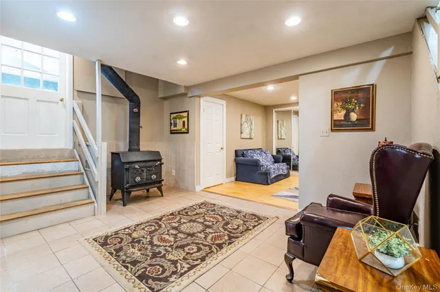 a bedroom with furniture and wooden floor
