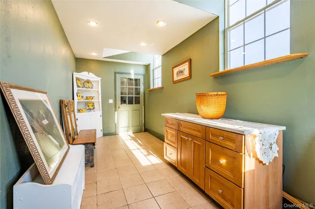 a hallway with cabinets