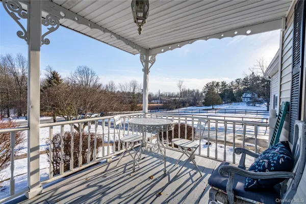 a view of balcony with furniture
