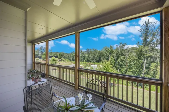 a en suite bathroom with a granite countertop sink and a mirror