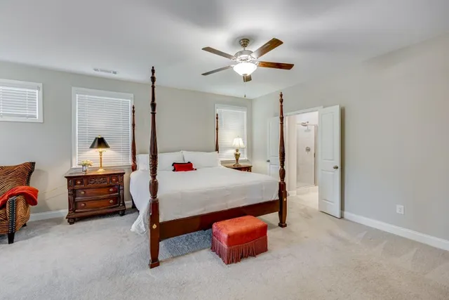 an aerial view of a house with swimming pool garden and patio
